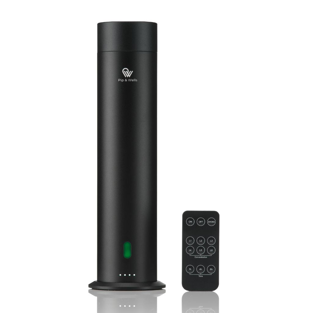Black Aroma diffuser with remote control on a white background
